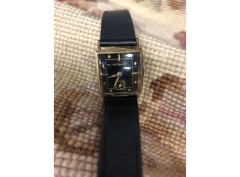 WITTNAUER 14K GOLD MEN'S WATCH WITH BLACK FACE & BLACK LEATHER BAND - 1.25'