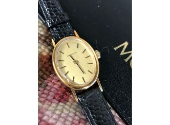 MOVADO 14K GOLD LADIES OVAL WATCH - 1.25'