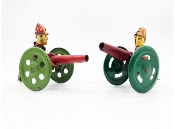 (2) 2 VINTAGE TIN TOYS-MEN WITH CANNONS-WORKS