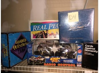 LOT OF 5 TOYS AND GAMES-TRIVIAL PURSUIT- RADIO CONTROL CAR- CARDS AGAINST HUMANITY- D4