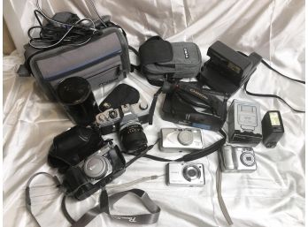 LOT OF 6 STILL VINTAGE CAMERAS AND 1 VINTAGE VIDEO CAMERA, 2 FLASHES,  CAMERA BAGS AND CORDS-A11