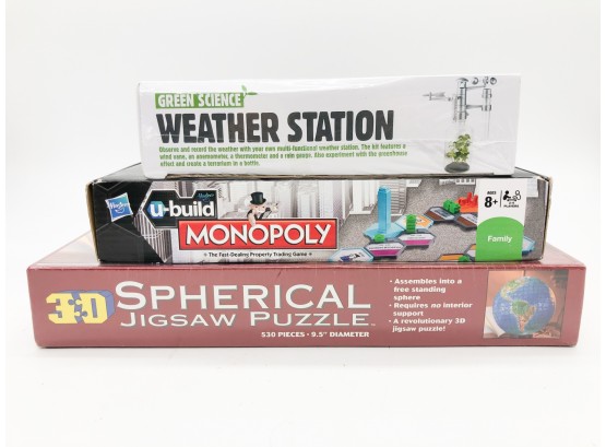(92) LOT OF THREE GAMES NEW IN PACKAGES - WEATHER STATION, U BUILD MONOPOLY & 3-D SPHERICAL JIGSAW PUZZLE