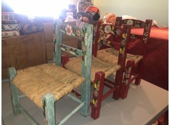 (132) LOT OF THREE VINTAGE CHILD / DOLL CHAIRS - RUSH SEAT WITH PAINTED WOOD FRAMES