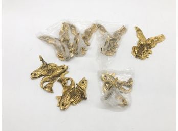 (70) LOT OF SEVEN BRASS WALL HOOKS - THREE DOUBLE FISH & FOUR EAGLES - 3'-4' - NEW IN PLASTIC