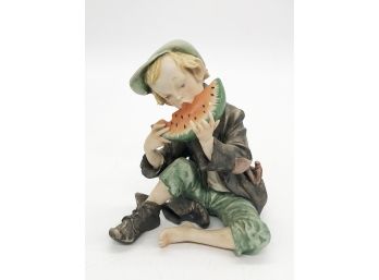 (98) VINTAGE PORCELAIN FIGURINE - BOY EATING WATERMELON - 6.5'