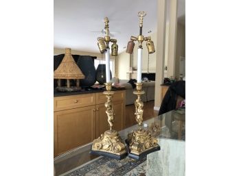 (114) PAIR OF VINTAGE BRONZE OR BRASS FIGURAL LAMPS - CHERUBS WITH MUSICAL INSTRUMENTS - MISMATCHED SHADES