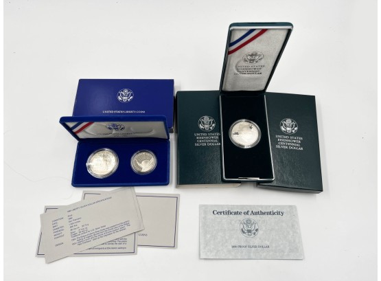 (125) LOT OF 2 COIN PROOF SETS-1986 SILVER DOLLAR W/CLAD HALF DOLLAR-US EISENHOWER CENT SILVER DOLLAR