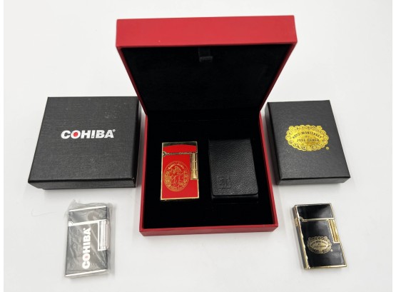 (102) LOT OF 3 NEW IN BOX LIGHTERS-COHIBA GAS LIGHTER,HOYO DE MONTERREY AND MC SIGNATURE-ALL UNTESTED