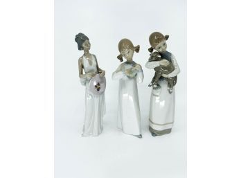 (L-19) THREE LLADRO PORCELAIN FIGURINES - TWO GIRLS & ONE SOPHISTICATED LADY WITH HAT - 8'-9'