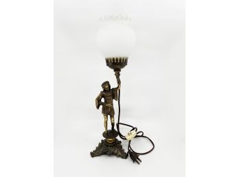 (L-33) VINTAGE GOLD METAL FIGURAL LAMP WITH YOUNG MAN HOLDING WHITE GLASS SHADE -18' BY 5'