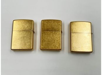 (LOT 105) LOT OF 3 VINTAGE 'ZIPPO' LIGHTERS-ALL GOLD TONED 2 FROM 2004 AND 1 FROM 2003-UNTESTED
