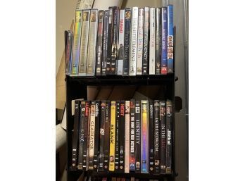 (BASE) APPROX. 100 DVD's / MOVIES WITH RACK