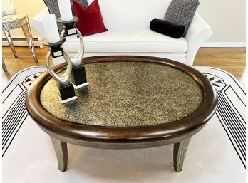 OVAL WOOD COFFEE TABLE WITH ANTIQUED SILVER & BRONZE FINISH - 60' LONG BY 44' WIDE BY 21' HIGH