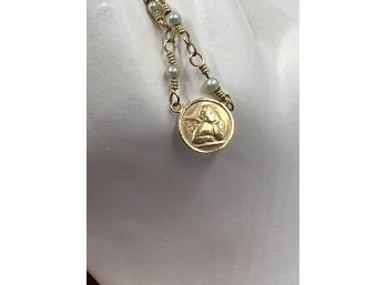 (J-16) VINTAGE 14KT GOLD ANGEL CHARM WITH CHAIN-CHAIN IS NOT GOLD-2.89 DWT