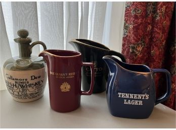 (DR-42) LOT OF FOUR VINTAGE LIQUOR ADVERTISING PITCHERS & A JUG - TENNENTS, BUCHANANS, WHISKEY