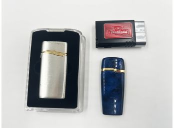(J-64) LOT OF 3 PREOWNED BUTANE LIGHTERS-1 IN CASE-2 NEED GAS