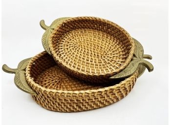 (A-101) TWO NESTING WOVEN OVAL SERVING BASKETS WITH BRASS LEAF HANDLES - 12'