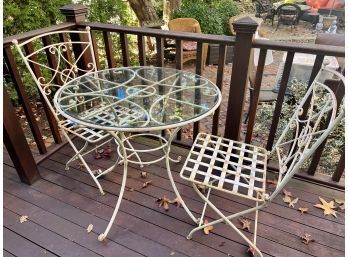 CAST IRON BISTRO SET WITH TABLE WITH GLASS TOP & TWO MATCHING FOLDING CHAIRS - 31' BY 30' HIGH