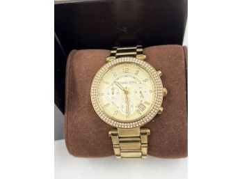 (J-23) PREOWNED MICHAEL KORS WOMANS GOLD TONE WATCH MK 5354-IN ORIGINAL CASE-NEEDS BATTERY