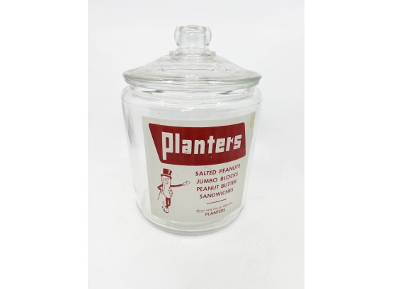 (A-20) VINTAGE 'PLANTERS PEANUTS' GLASS STORAGE / CANDY STORE JAR WITH LID -11' BY 7'