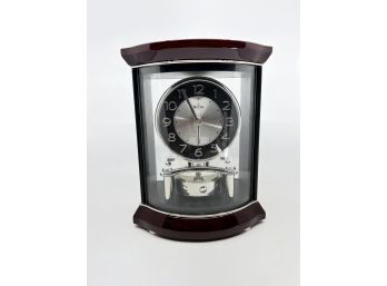 (A-93) BULOVA WOOD & SILVER DESK CLOCK  - BATTERY OPERATED - 8' BY 10'