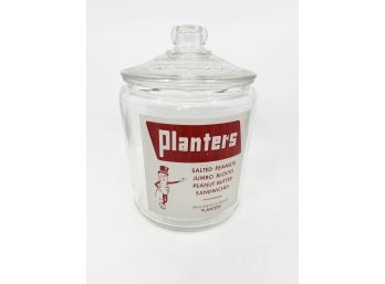 (A-20) VINTAGE 'PLANTERS PEANUTS' GLASS STORAGE / CANDY STORE JAR WITH LID -11' BY 7'