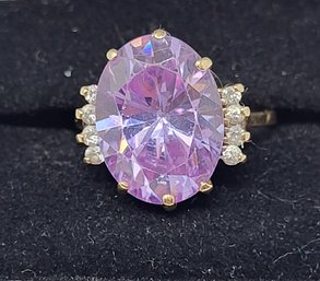 10KT Yellow Gold With 8 Diamonds And Pink/purple Gemstone Size 8.5, Stone Is 11/16' By 12'