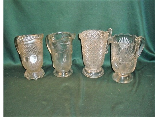 4 Clear Pattern Glass Pitchers, All About 9' H    (52)