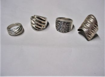 4 Silver Rings, 33.9 Grams    (261)