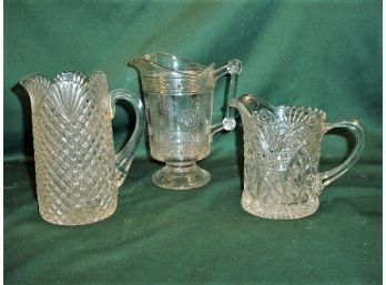3 Antique Clear Pressed Pattern Glass Pitchers, 6', 7', 8' H   (53)