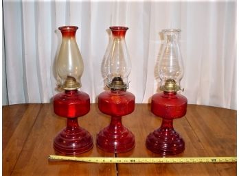 Group Of 3 Oil Lamps With Red Glass Bases  (450)
