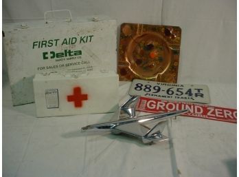 2 First Aid Kits, Hood Ornament, Virginia Licence Plate, Ground Zero Plate, Ashtray   (1386)