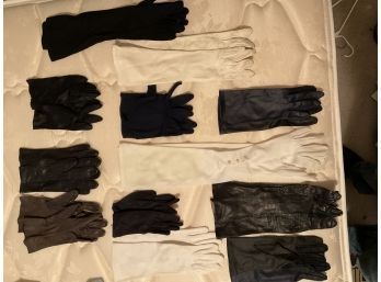 12 Pair Of Gloves.  Most Are Leather