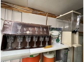 Shelf Lot. Goblets And A Drink Dispenser
