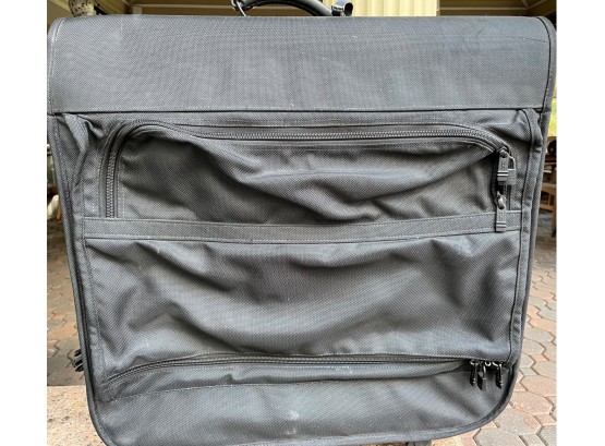 Tumi Garment Bag. More Like A Suitcase. Has Number Locks On Both The Sides