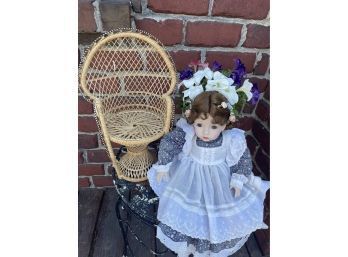 Signed / Numbered Porcelain Doll & Wicker Chair