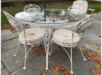 Round Iron Base Glass Top Table With Four Chairs And Cushions