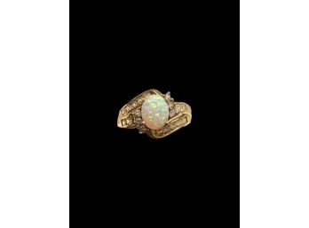 Oval Opal With Diamonds On Both Sides Of The Marked 10k