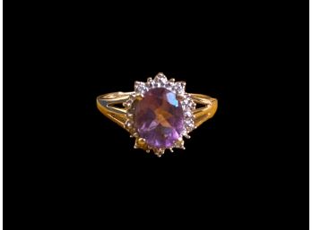 Amethyst Surrounded By Diamond Chips In 10K Setting