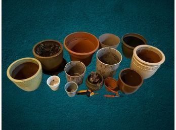 13 Flower Pots. 10 Are Ceramic And Clay. 3 Are Plastic.