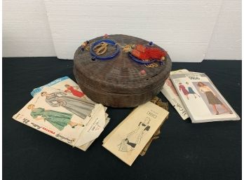 Decorative Sewing Basket Full Of  Notions And Dress Patterns