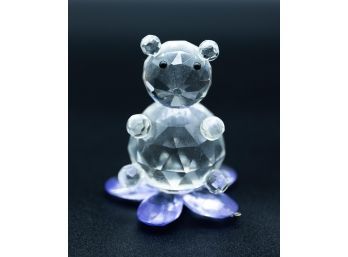 Crystal Bear Figurine Sitting On Purple Flower