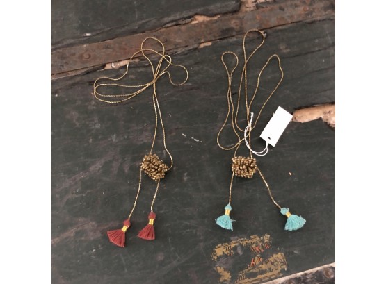 Gold Metal Necklaces With Red And Teal Tassels