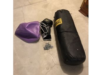 Punching Bag With Chain And Gloves And An Exercise Ball