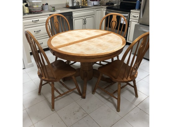 Bernie & Phyl's Round Tile Top Table With Four Chairs And Hidden Leaf