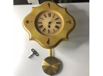 Yellow Wooden Clock With Pendulum And Key