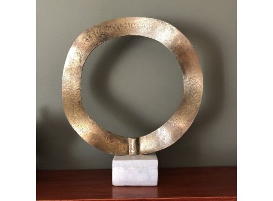 Sculptural Metal Ring On A Marble Base