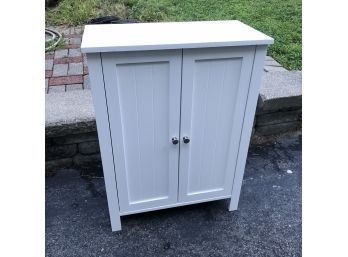 White Two-door Cabinet With Shelves Inside