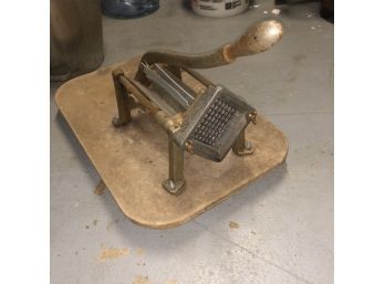 Vintage French Fry Press Mounted To A Board
