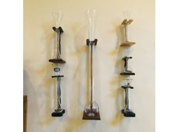 Collection Of Tall Beer Glasses On A Wall Display